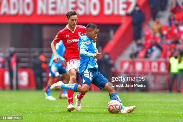 Marcel Ruiz of Toluca fights for the ball with Erick Sanchez of Pachuca during the 11th round match between Toluca and Pachuca as part of the Torneo...