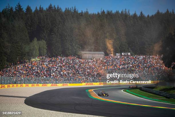 Max Verstappen of the Netherlands driving the Oracle Red Bull Racing RB18 leads Charles Leclerc of Monaco driving the Ferrari F1-75 during the F1...