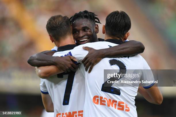 Teun Koopmeiners of Atalanta BC celebrates with Duvan Zapata and Rafael Toloi after scoring their team's first goal during the Serie A match between...