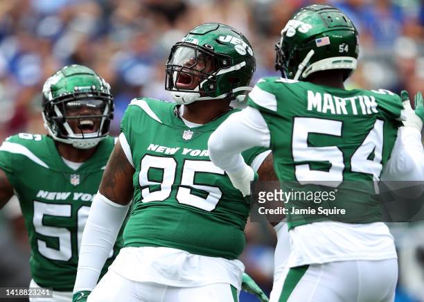 Defensive lineman Quinnen Williams celebrates with linebacker Quincy Williams and defensive end Jacob Martin after a sack during the 1st half of the...