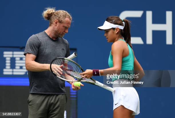 Emma Raducanu of Great Britain in a practice session with coach Dmitry Tursunov during previews for the 2022 US Open tennis at USTA Billie Jean King...