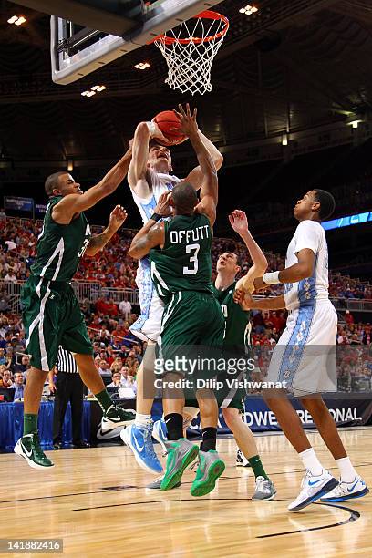 Tyler Zeller of the North Carolina Tar Heels attempts a shot against Reggie Keely and Walter Offutt of the Ohio Bobcats during the 2012 NCAA Men's...