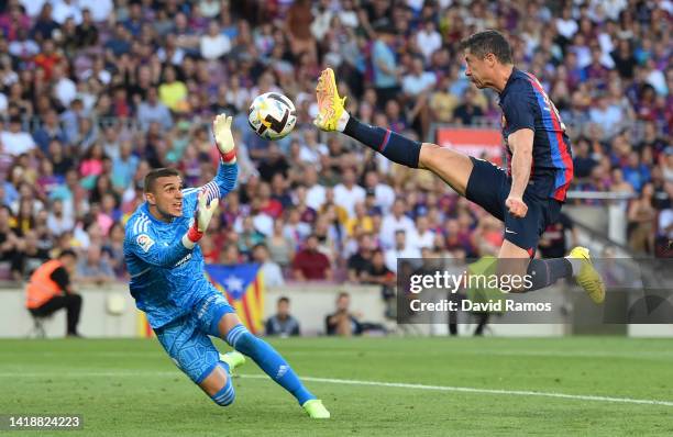 Robert Lewandowski of Barcelona scores their side's first goal past Jordi Masip of Real Valladolid during the LaLiga Santander match between FC...