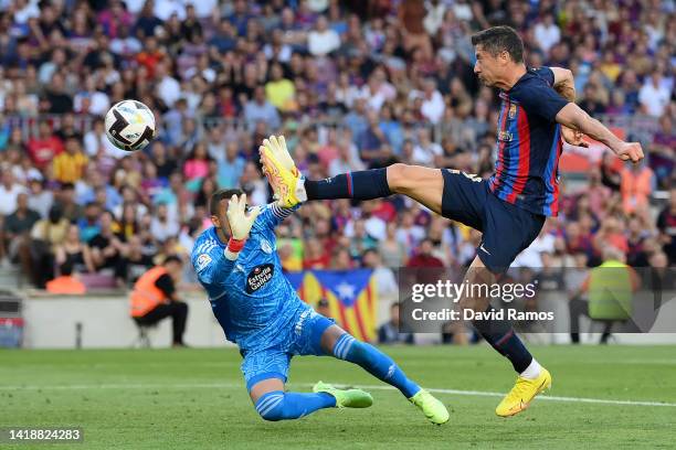 Robert Lewandowski of Barcelona scores their side's first goal past Jordi Masip of Real Valladolid during the LaLiga Santander match between FC...