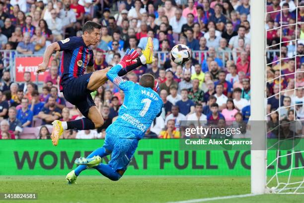 Robert Lewandowski of Barcelona scores their side's first goal past Jordi Masip of Real Valladolid during the LaLiga Santander match between FC...