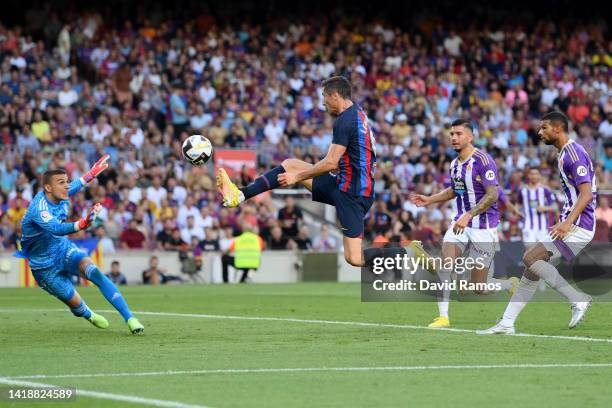 Robert Lewandowski of Barcelona scores their side's first goal past Jordi Masip of Real Valladolid during the LaLiga Santander match between FC...