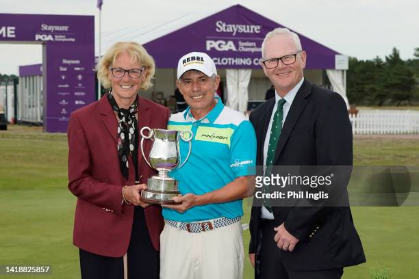 Adilson Da Silva of Brazil poses with Sarah Bennett, Captain PGA GB&I and Kevin Watkins, Captain Formby Golf Club during Day Four of the Staysure PGA...