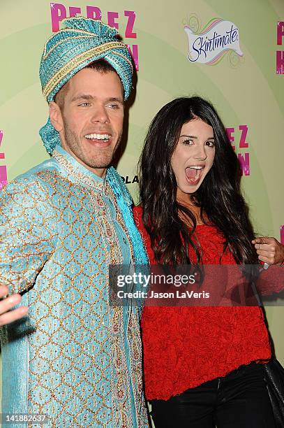 Perez Hilton and Shenae Grimes attend Perez Hilton's Mad Hatter tea party birthday celebration on March 24, 2012 in Los Angeles, California.