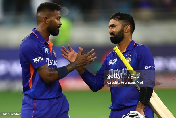 Hardik Pandya and Dinesh Karthik of India celebrates victory after the DP World Asia Cup T20 match between Pakistan and India at Dubai International...