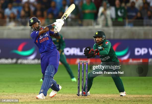 Hardik Pandya of India hits the winning runs during the DP World Asia Cup T20 match between Pakistan and India at Dubai International Stadium on...