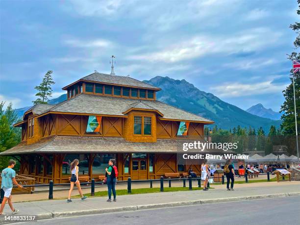 men and women walking outside the history museum, banff - banff museum stock pictures, royalty-free photos & images