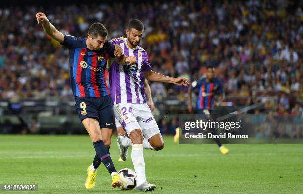 Robert Lewandowski of Barcelona scores their side's third goal during the LaLiga Santander match between FC Barcelona and Real Valladolid CF at Camp...