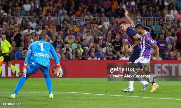 Robert Lewandowski of Barcelona scores their side's third goal during the LaLiga Santander match between FC Barcelona and Real Valladolid CF at Camp...