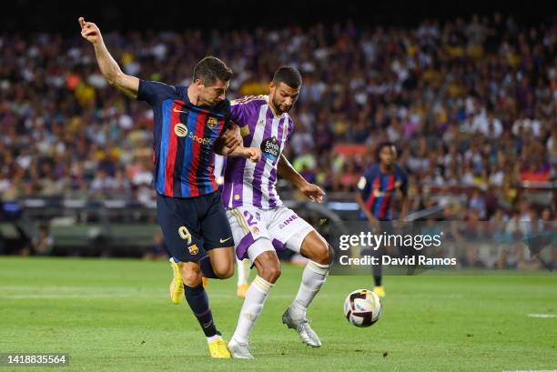 Robert Lewandowski of Barcelona scores their side's third goal during the LaLiga Santander match between FC Barcelona and Real Valladolid CF at Camp...