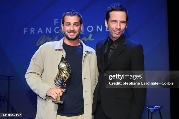 French director Leopold Legrand for "Le Sixieme Enfant " poses with his trophy after winning the Valois de la Musique award, the Valois du scenario...