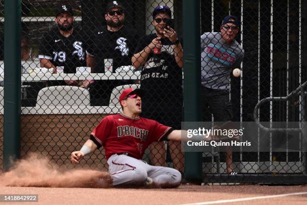 Daulton Varsho of the Arizona Diamondbacks comes up short on a fly ball off the bat of Andrew Vaughn of the Chicago White Sox that went for a double...