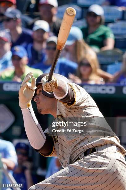 Manny Machado of the San Diego Padres hits a two-run home run in the fifth inning against the Kansas City Royals at Kauffman Stadium on August 28,...