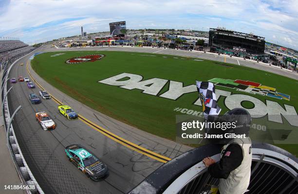 Austin Dillon, driver of the BREZTRI Chevrolet, takes the checkered flag to win the NASCAR Cup Series Coke Zero Sugar 400 at Daytona International...