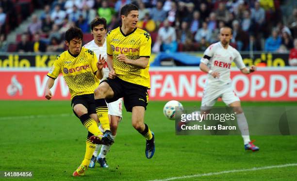 Shinji Kagawa of Dormtund scores his teams fives goal during the Bundesliga match between 1. FC Koeln and Borussia Dortmund at RheinEnergieStadion on...
