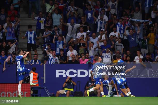 Joselu of Espanyol celebrates with teammates after scoring their side's first goal during the LaLiga Santander match between RCD Espanyol and Real...