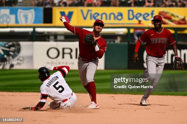 Josh Rojas of the Arizona Diamondbacks gets the out on Josh Harrison of the Chicago White Sox in a double play that was overturned at first base on...