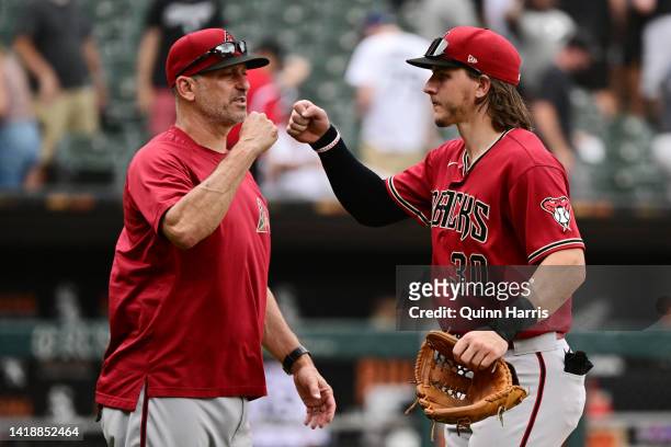 Jake McCarthy and manager Torey Lovullo of the Arizona Diamondbacks celebrate a 3-2 win against the Chicago White Sox at Guaranteed Rate Field on...