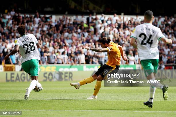 Ruben Neves of Wolverhampton Wanderers scores his team's first goal during the Premier League match between Wolverhampton Wanderers and Newcastle...