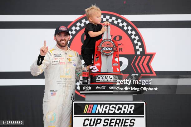 Austin Dillon, driver of the BREZTRI Chevrolet, celebrates with his son, Ace R.C in victory lane after winning the NASCAR Cup Series Coke Zero Sugar...