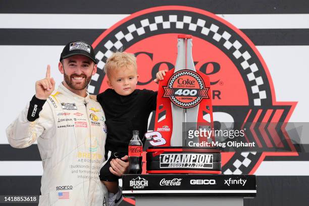 Austin Dillon, driver of the BREZTRI Chevrolet, celebrates with his son, Ace R.C in victory lane after winning the NASCAR Cup Series Coke Zero Sugar...