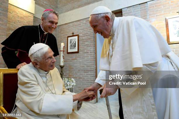 Pope Francis greets Pope Emeritus Benedict XVI during a meeting with newly named Cardinals at the Vatican's Mater Ecclesiae Monastery on August 27,...