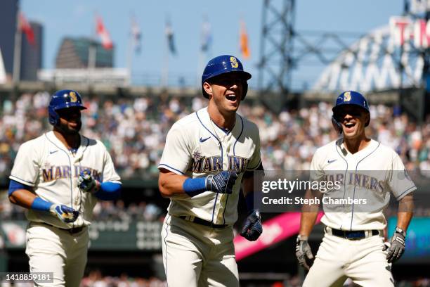 Dylan Moore of the Seattle Mariners celebrates his three-run home run against the Cleveland Guardians during the fifth inning at T-Mobile Park on...