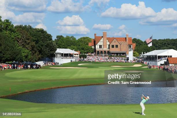 Rory McIlroy of Northern Ireland plays a shot on the 18th hole during the final round of the TOUR Championship at East Lake Golf Club on August 28,...