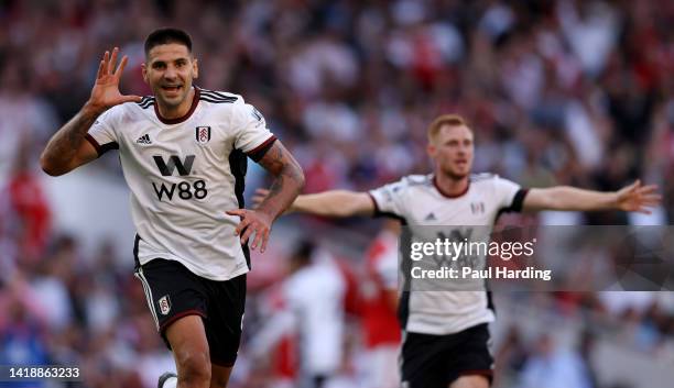 Aleksandar Mitrovic of Fulham celebrates after scoring their team's first goal during the Premier League match between Arsenal FC and Fulham FC at...