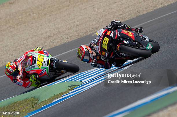 Alvaro Bautista of Spain and San Carlo Honda Gresini leads Valentino Rossi of Italy and Ducati Marlboro Team during the third day of testing of...