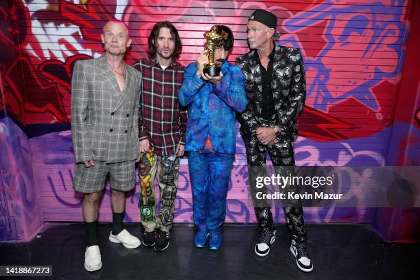 Flea, John Frusciante, Anthony Kiedis, and Chad Smith of Red Hot Chili Peppers are seen backstage at the 2022 MTV VMAs at Prudential Center on August...