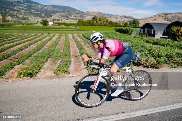 Athletes compete in the bike portion during the IRONMAN Canada on August 28, 2022 in Penticton, British Columbia.
