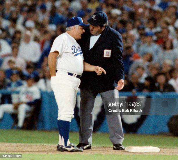 Los Angeles Dodgers Manager Tommy Lasorda has a friendly discussion with umpire at 1st base during Los Angeles Dodgers vs St. Louis Cardinals MLB...