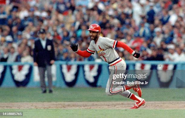 St. Louis Cardinals Ozzie Smith gets the jump on Dodgers Pitcher Fernando Valenzuela, then slides safely into 2nd base during playoff series of the...