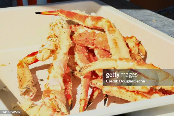 prepared crab legs in a serving dish - crab legs stock pictures, royalty-free photos & images