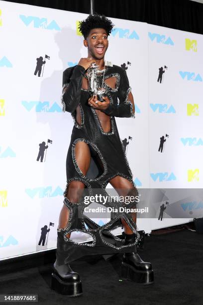 Lil Nas X winner of the Best Collaboration award for 'Industry Baby' poses in the press room at the 2022 MTV VMAs at Prudential Center on August 28,...