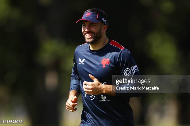 James Tedesco smiles during a Sydney Roosters NRL training session at Kippax Lake on August 29, 2022 in Sydney, Australia.