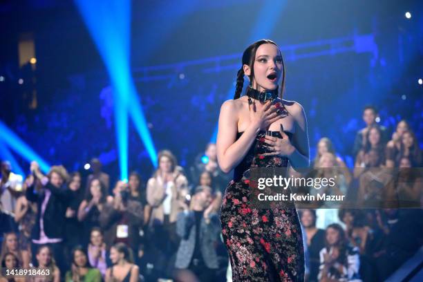 Dove Cameron accepts the Best New Artist award for 'Disruptor Records / Columbia Records' onstage at the 2022 MTV VMAs at Prudential Center on August...