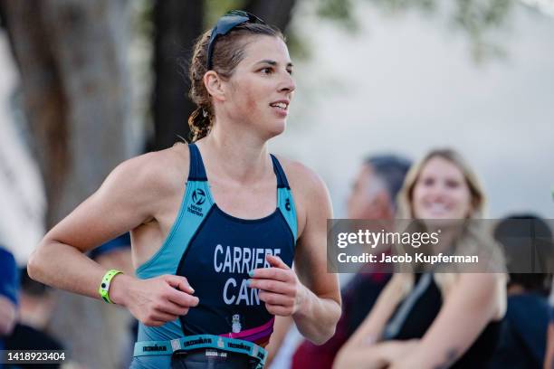 Athletes compete in the run portion during the IRONMAN Canada on August 28, 2022 in Penticton, British Columbia.