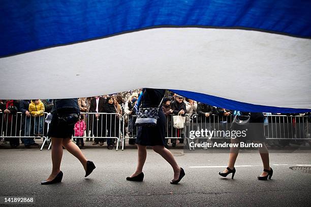 Women participating in the annual Greek Independence Day Parade carry a Greek flag down Fifth Avenue on March 25, 2012 in New York City. It was the...