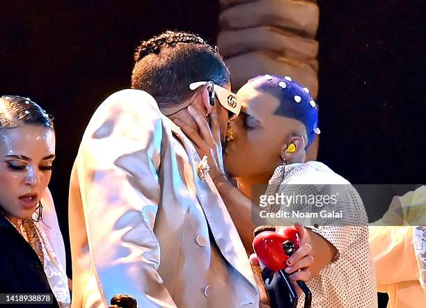 Bad Bunny kisses a dancer at Yankee Stadium for the 2022 MTV VMAs broadcast on August 28, 2022 in New York City.