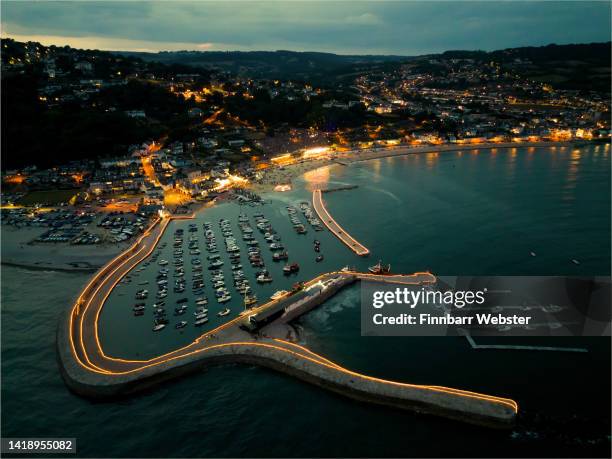 An aerial view of the Candles On The Cobb, as thousands of candles light up the Cobb harbor in memory of loved ones on August 28, 2022 in Lyme Regis,...