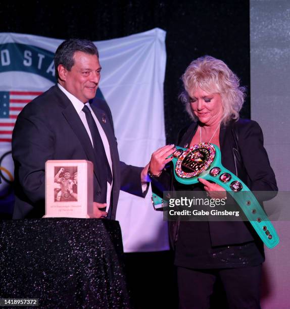World Boxing Council President Mauricio Sulaimán presents Brenda Glur-Spinks with a WBC World Champion belt during Leon Spinks celebration of life...
