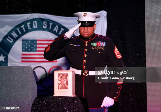Marine Corps gunnery sergeant Larry Shead salutes Leon Spinks' custom urn during Leon Spinks celebration of life and memorial service at The Modern...