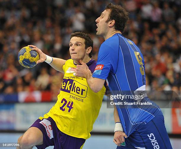 Igor Vori of Hamburg challenges Bartlomiej Jaszka of Berlin during the EHF Champions League match between HSV Hamburg and Fuechse Berlin at the O2...