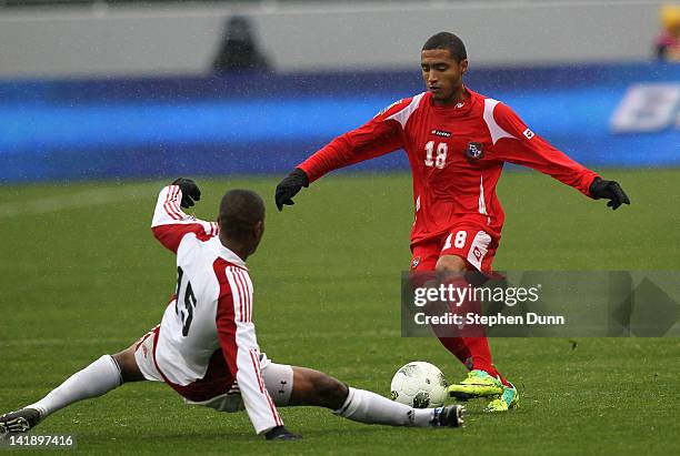 Manuel Asprilla of Panama controls the ball in front of Curtis Gonzales of Trinidad and Tobago during the fourth day of 2012 CONCACAF Men's Olympic...